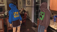 A digital drawing of Edric Tosser and Declan Suzanne. They both tied their hoodie strings together and have pulled against each other to close the hoodie part of their jackets shut around their heads. Edric is wearing a blue sweatshirt with a high school logo on it, while Declan has a Minecraft Creeper decal on the front of their hoodie. They are both standing up. /end image description